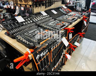 Kyiv, Ukraine - February 04, 2025: Various toolkits neatly arranged on shelves, showcasing hand tools for sale Stock Photo