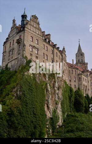 Majestic Sigmaringen Castle Perched on Rugged Cliff Above Tranquil Danube: Historic Hohenzollern Residence Showcases Medieval Architecture and Royal Stock Photo
