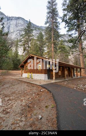 Park restroom nestled in Yosemite Valley. Visitors can use facilities