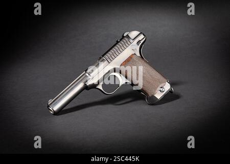 Studio shot of a Savage Mod. 1907 historical pistol handgun on black background with dramatic light Stock Photo