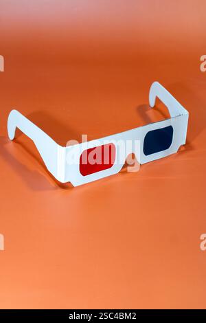 3D glasses on orange background.  Stock Photo