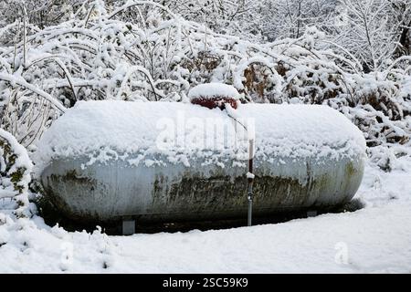 Snow covered residential propane tank in winter Stock Photo