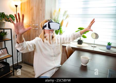 Immersed in virtual reality experience at home during a quiet afternoon Stock Photo