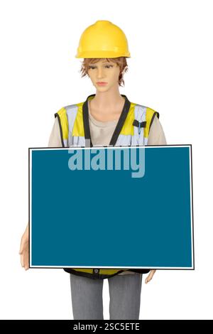 Vertical shot of a female mannequin in construction garb holding a blank blue sign. Stock Photo