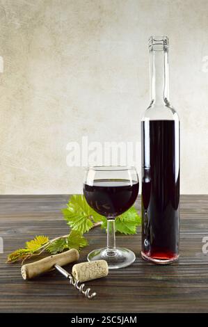 Red wine on wooden background, vertical image Stock Photo
