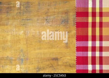 Checkered tablecloth on wooden table Stock Photo