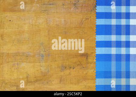 Blue checkered tablecloth on wooden background Stock Photo