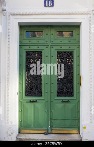 Paris, France, 02.02.2025 Beautiful pastel green door in the 5th arrondissement of Paris Stock Photo