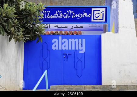 Chefchaouen, Rif Mountains, Morocco, Blue entrance gate of a school with Arabic writing on stony stairs, Chefchaouen, Morocco, Africa Stock Photo