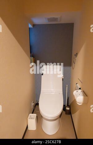 Modern Japanese toilet design in compact bathroom setting showcasing innovative features Stock Photo