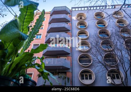 A quirky modern apartment building with circular windows in Barcelona, Spain Stock Photo