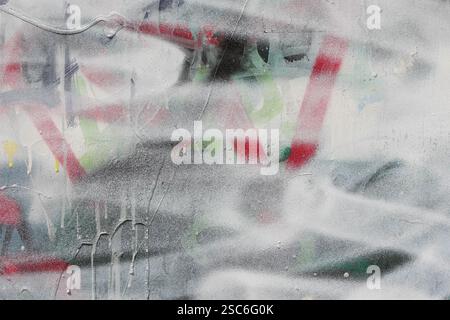 Messy layers of graffiti paint abstract urban art background with copyspace. Stock Photo