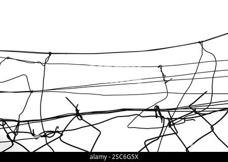 Tangled wires damaged fence abstract shapes. Black and white background ...