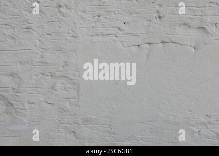 White brick wall weathered background texture with copyspace. Stock Photo