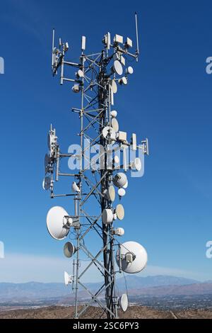 telecommunications tower with antennas on top of a mountain Stock Photo