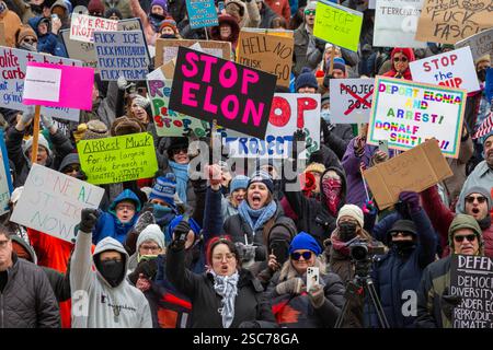 Lansing, Michigan, USA. 5th Feb, 2025. People rally at the Michigan state capitol to oppose President Trump, Elon Musk, and Project 2025. Similar rallies were planned across the country, many of them at state capitols. Credit: Jim West/Alamy Live News Stock Photo