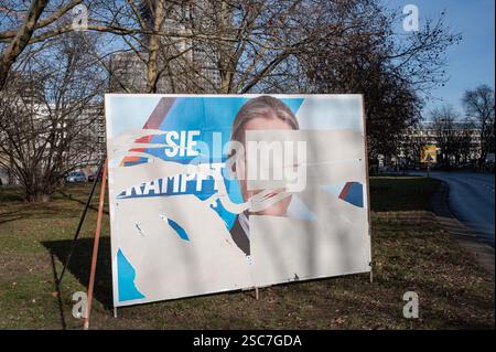 24.01.2025, Germany, Berlin, Berlin - A billboard with a partially torn off election poster of the right-wing populist AfD shows a portrait of their c Stock Photo