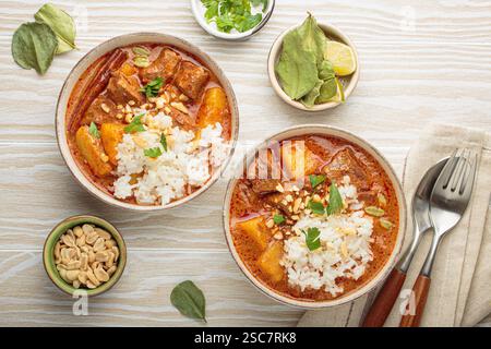 Massaman curry with beef, potatoes and rice Stock Photo