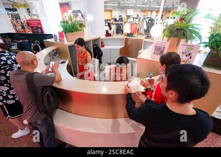 Bangkok, Thailand - January 24, 2020: customers interacting with staff at a customer service counter at CentralWorld shopping mall. Stock Photo