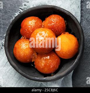 Gulab Jamun. Traditional oriental food concept. Indian sweet snacks. Top view, flat lay Stock Photo