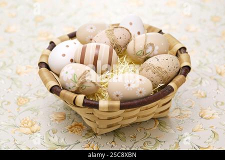 Simple, calm and coloring beautiful easter eggs in the basket. Greeting card design. Stock Photo