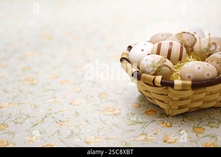 Simple, calm and coloring beautiful easter eggs in the basket. Greeting card design. copy space. Stock Photo