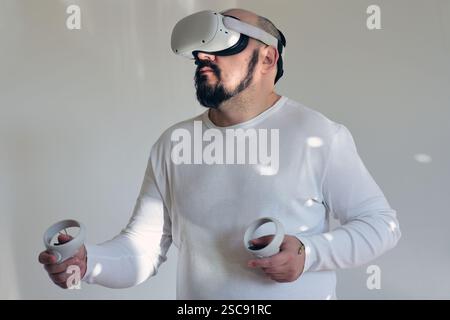 Man exploring in virtual reality headset Stock Photo
