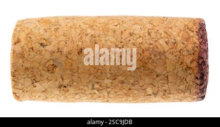 Detailed close-up of a used wine cork with textured surface and a red wine-stained edge isolated on a white background Stock Photo