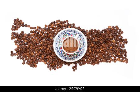 Turkish coffee concept, turkey map of the roasted coffee beans isolated on white background, traditional hot drink coffee in porcelain cup Stock Photo