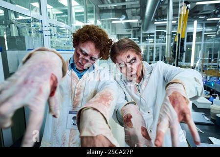 Zombie Lab Workers Reaching Out Hands Stock Photo