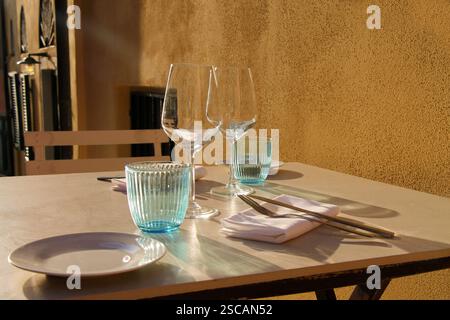 A table set with dishes in a street restaurant close-up. Stock Photo