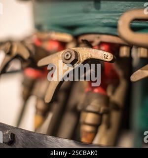 Antique Fireman's Nozzle: Collection of vintage fireman's nozzles displayed, focusing on their unique designs and historical utility in firefighting. Stock Photo