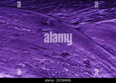 Abstract background with purple plaster texture. Seamless background with large brush strokes. Rough stylized texture with space for text. High qualit Stock Photo