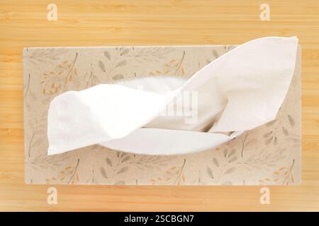 Top view of a tissue box on a wooden table Stock Photo