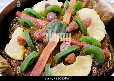 Close-up of a homemade Christmas cake topped with crystallised fruit Stock Photo