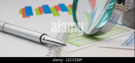 Graphs tables and documents laid on the table Stock Photo