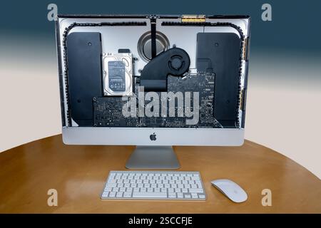 What's under the hood on a 2012 Apple iMac with screen removed to display internal circuit boards and layout of components. Stock Photo
