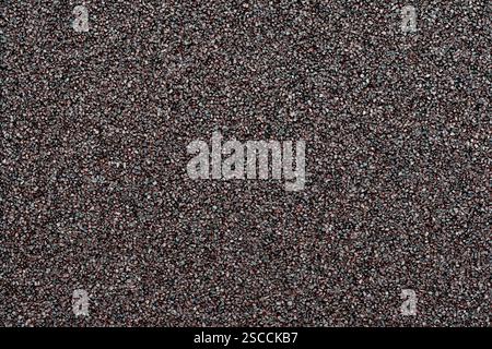 Small black stones texture and pattern, close-up photo suitable for background or design backdrop. Similar to small compact black pebbles or gravel or Stock Photo