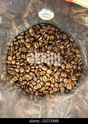 Heap of Coffee beans in package ready to use italian roast Stock Photo