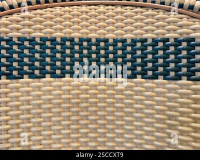 Close up of synthetic rattan or wicker weaving art in various patterns and colors. Rattan hand woven background seamless texture. Stock Photo