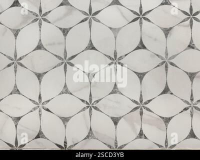 Random round floral pattern or ‘Kawung’ illustration silhouette at wall finishes or screen panel. This random circular floral laser cut patterns Stock Photo