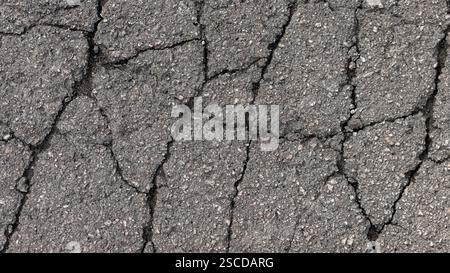 Cracks in specialized road surface. Structured, background image Stock Photo