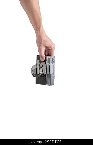 Old camera in hand isolated on white background Stock Photo