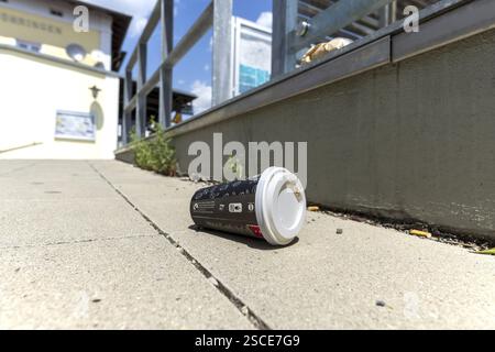 Discarded disposable cup, coffee cup, rubbish, railway station in Voehringen, Bavaria, Germany, Europe Stock Photo