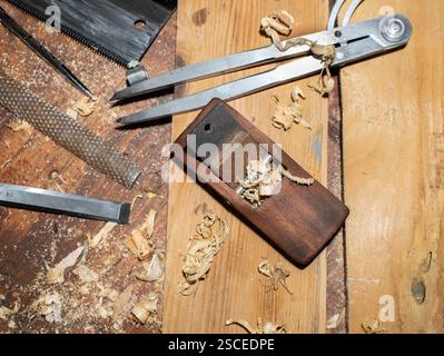 Old planer and other vintage carpenter tools in a carpentry workshop Stock Photo