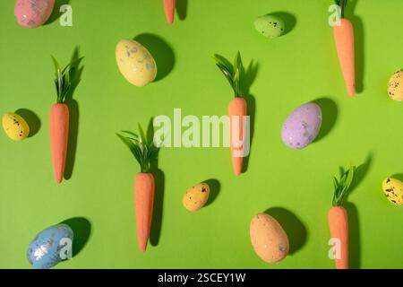 Easter pattern made with carrots on bright blue background. Creative minimal holiday concept Stock Photo