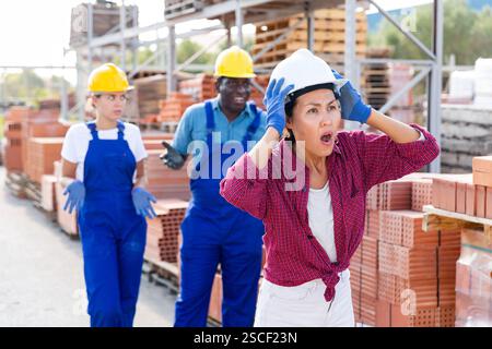 Taskmaster amazed by something in outdoor warehouse Stock Photo