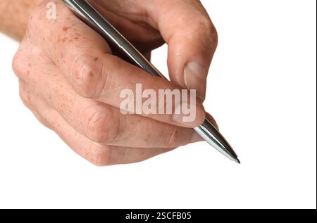 Closeup person hand writing with a pen isolated cutout on white Stock Photo