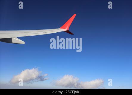View from the passenger plane window. The wing of an airplane. The concept of vacation, travel, logistics Stock Photo