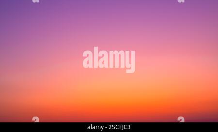 Background image of sky gradient with beautiful pastel pink and orange and purple in the evening as the sun sets, Atmosphere of the twilight sky was c Stock Photo